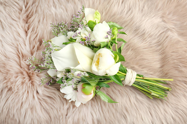 Bouquet of beautiful fragrant flowers on furry fabric - Foto, imagen