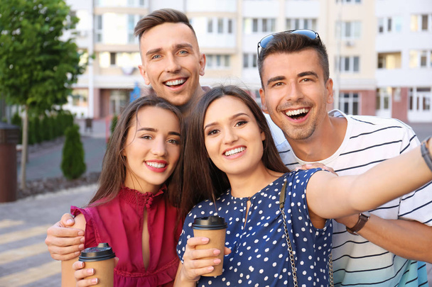 Group of young people taking selfie outdoors - Фото, зображення