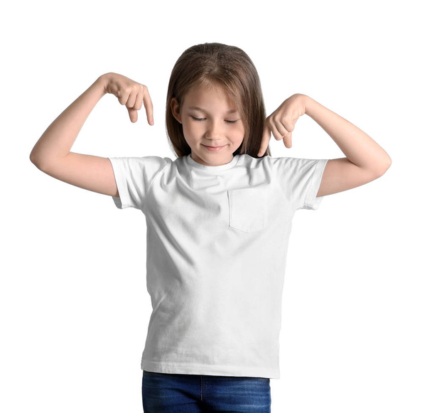 Little girl in t-shirt on white background. Mockup for design - Foto, immagini