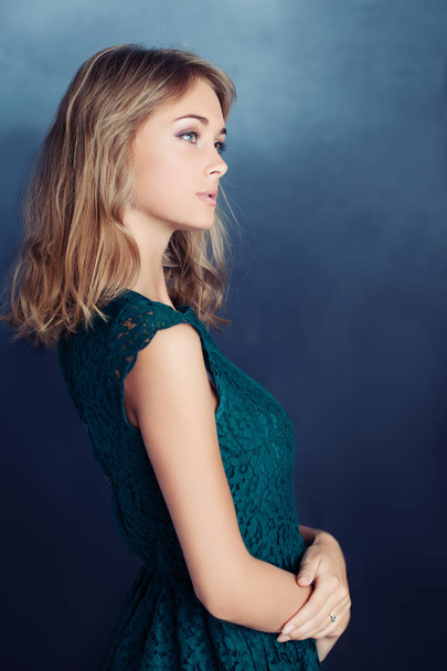 Beautiful Young Woman on Blue Background - Foto, afbeelding