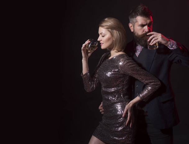 Tips for employers about alcohol at company events. Man and fancy lady at corporate party drinking. Celebration with alcohol concept. Man with beard and woman office workers celebrating holiday - Foto, Imagem