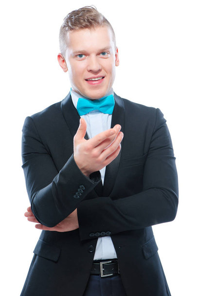 Cheerful young man in suit and bowtie gesturing and smiling - Fotografie, Obrázek