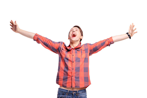 Studio portrait of excited handsome young man with hands up - Фото, зображення