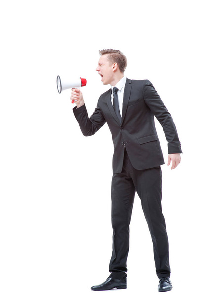 Full length of young businessman using megaphone isolated on white. - Valokuva, kuva