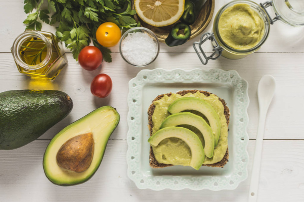 Fresh Avocado Spread Guacamole as Healthy Breakfast on White Bac - Fotó, kép