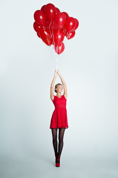 Young Woman with Red Balloons, Holiday Concept - Photo, Image