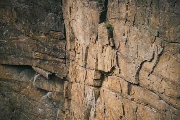 full frame image of rocky cliff surface background  - Foto, afbeelding