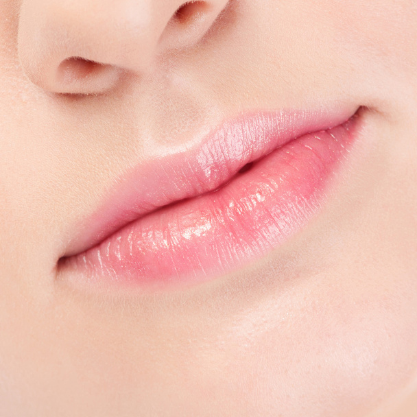 Close-up face of beauty young woman. Lips zone - 写真・画像