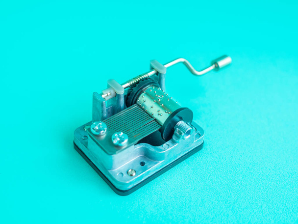 Vintage Small Mechanical Music Box Isolate on Aqua Blue Background Minimal Style - Photo, Image