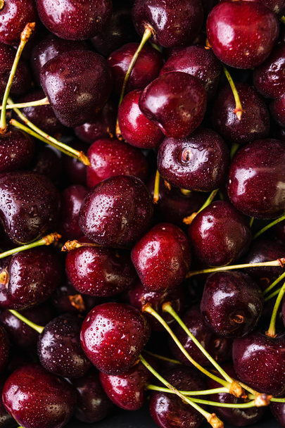 Ripe cherries with waterdrops background. Closeup view. - Fotó, kép