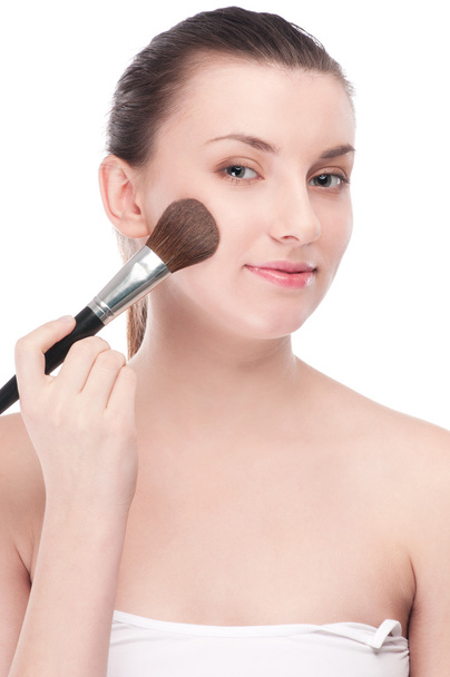 Beautiful woman with make up brush - Foto, afbeelding