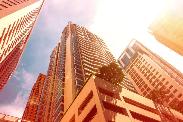 low angle view of high buildings on blue sky background - Photo, Image