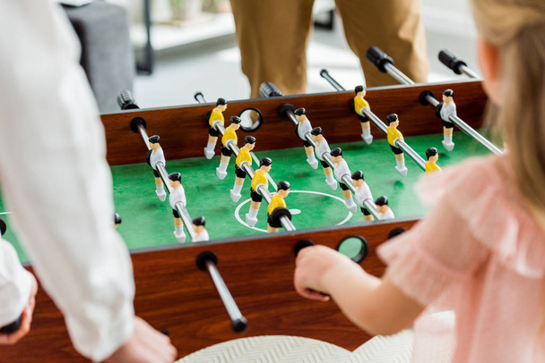 cropped shot of family playing table football together at home - Fotoğraf, Görsel