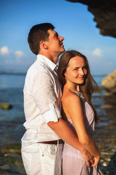 Portrait of happy couple, near the beach at background of sky. - Zdjęcie, obraz