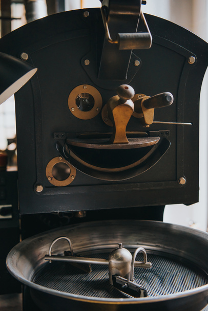 Adjusting handles of machine for professional coffee production - 写真・画像