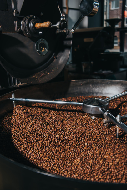 Roasting coffee beans in industrial coffee roaster - Photo, Image