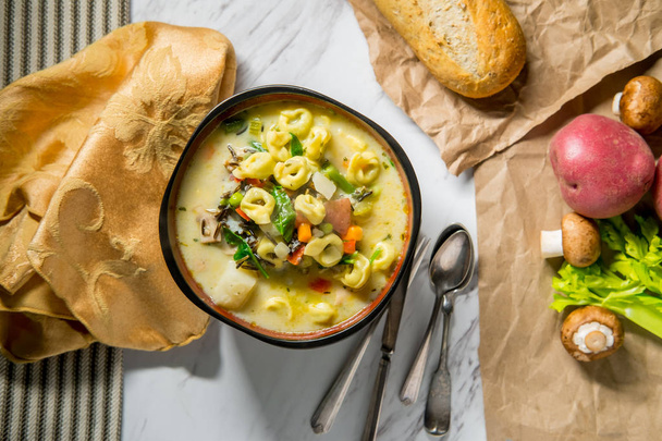 Creamy Italian tortellini wild rice soup with vegetables - Photo, Image
