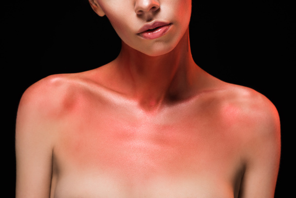 cropped view of nude woman with red body art, isolated on black - Photo, Image