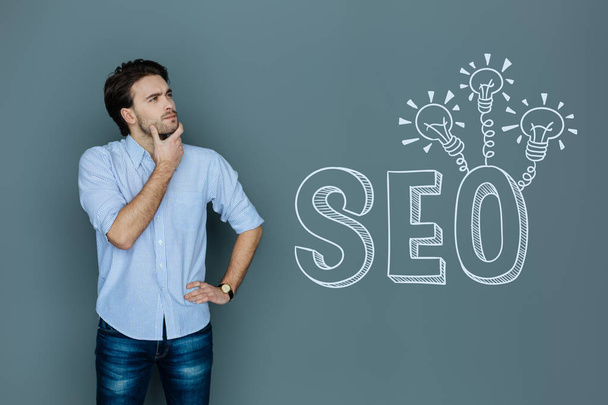Professional copywriter thinking while working with SEO - Foto, Imagen