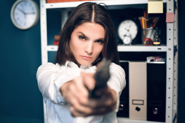 Woman playing around with gun. - Foto, Imagen