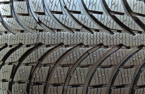 Contacto parche de neumático sin tacón con patrón de banda de rodadura simétrica macro shot
 - Foto, imagen