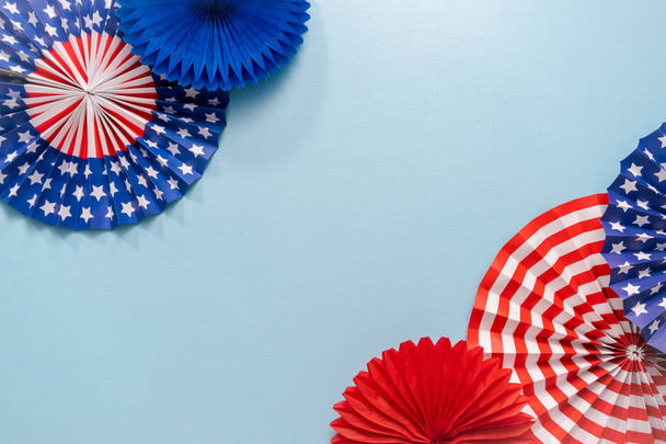 July 4th theme paper fans on blue background. - Photo, Image
