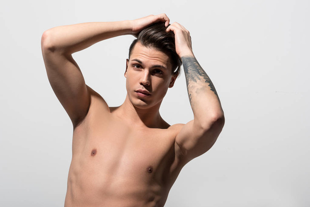 Shirtless attractive guy is posing pensively - Zdjęcie, obraz