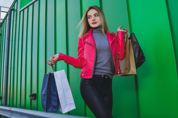 Beautiful blonde girl, shopping with bags - Fotoğraf, Görsel