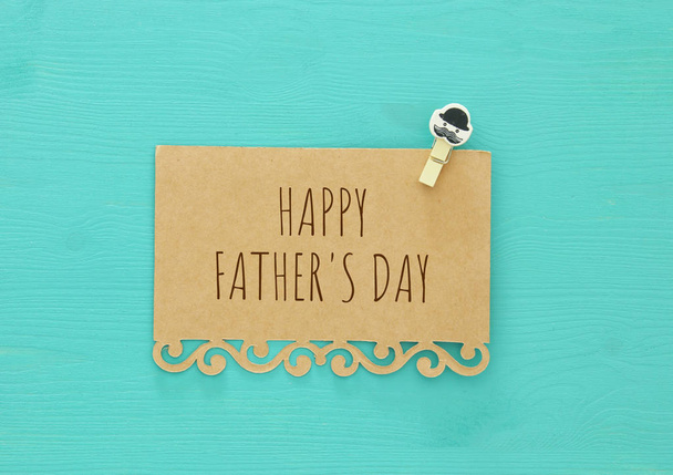 top view photo of open note with greeting for father's day over wooden background - Φωτογραφία, εικόνα