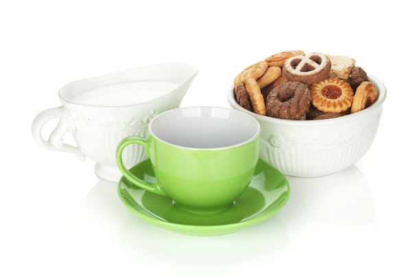 Various cookies, milk and tea cup - Photo, Image
