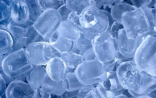 Фон з кубиками льоду в синьому світлі
 - Фото, зображення