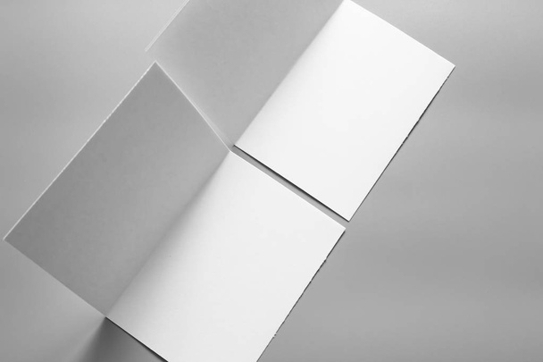 Blank portrait mock-up paper. brochure magazine isolated on gray, changeable background / white paper isolated on gray - Фото, зображення