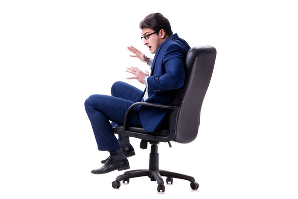 Uomo d'affari seduto sulla sedia da ufficio isolato su bianco
 - Foto, immagini