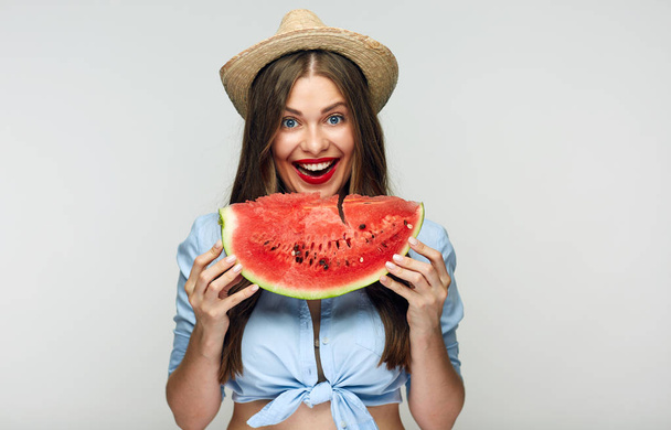 smiling woman in Mexican style clothes holding watermelon - Photo, image