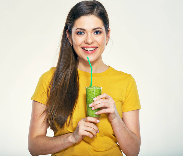 Smiling woman with long hair holding glass with green smoothie  - Foto, Bild