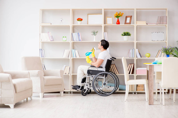 Disabled cleaner doing chores at home - Foto, Bild
