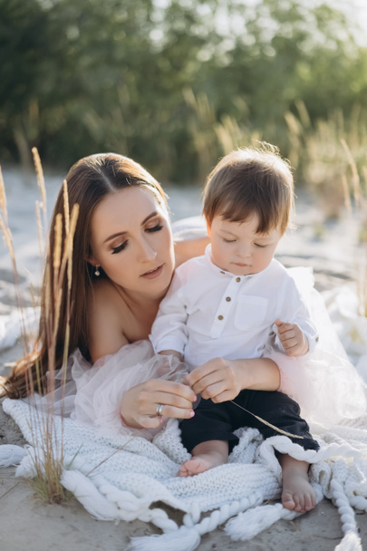young mother spending time with adorable baby boy on beach - Zdjęcie, obraz