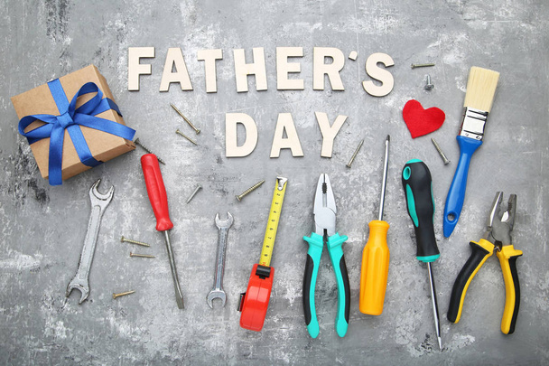 Colorful background with inscription Fathers Day and decorations on concrete backdrop - Foto, Bild