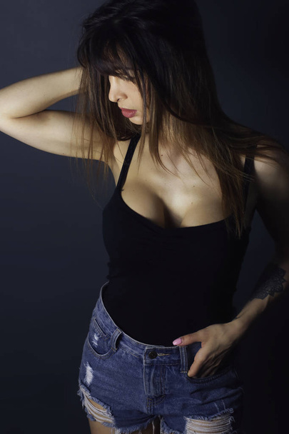 beautiful fashion woman wearing a black tank top - Foto, imagen