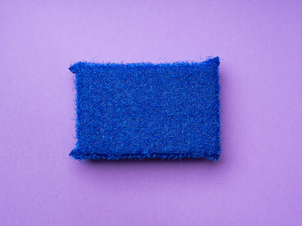 Cleaning sponge on purple background - Fotografie, Obrázek