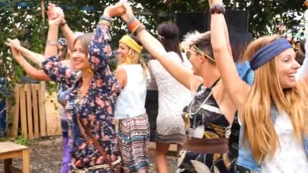 group of crazy women mixed ages from young to old having fun  all together in a hippy style event. celebrating group people concept with colored clothes and happiness - Footage, Video