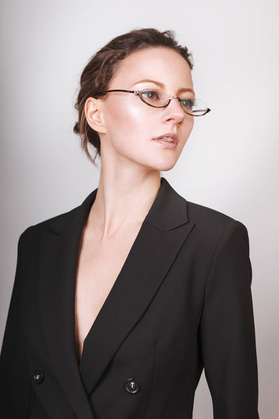 Woman. Glasses. Jacket. Isolated on white background - Foto, afbeelding