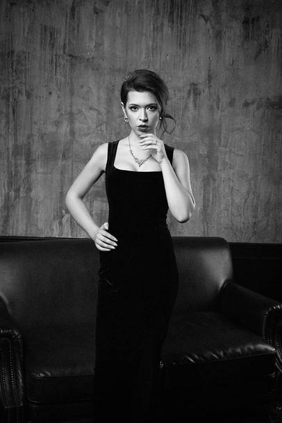 Gorgeous young brunette woman in elegant dress posing - Fotografie, Obrázek