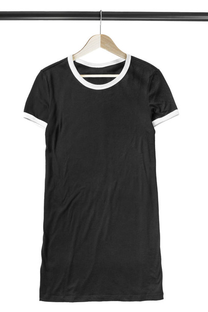 Black sport t-shirt dress hanging on wooden clothes rack isolated over white - Фото, зображення