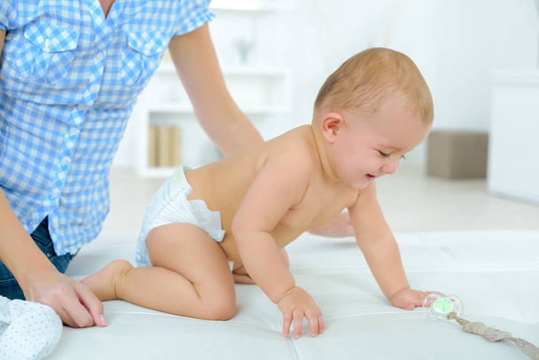baby wearing diaper and baby - Фото, зображення