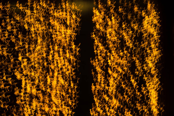 černé pozadí a žluté odlesky bokeh - Fotografie, Obrázek
