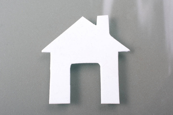 Little house cut out of paper in hand in view - Photo, Image