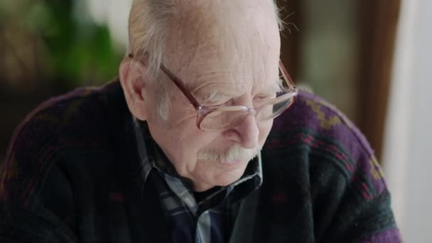 Portrait of senior mature old man on his 70s looking sad and worried suffering pain and depression in sadness face expression isolated in retirement - Video, Çekim