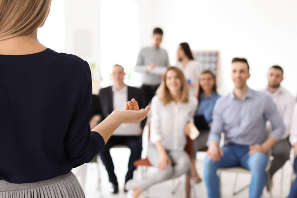 Female business trainer giving lecture in office - Photo, image