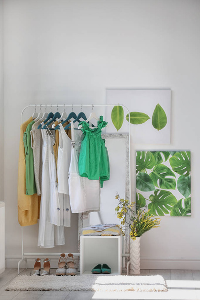 Stylish dressing room interior with clothes rack and mirror - Foto, Imagen